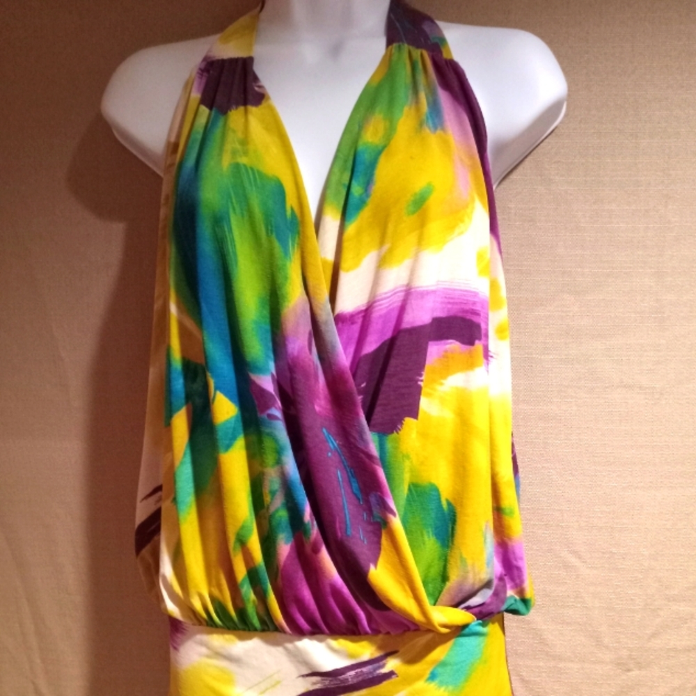 Flowered halter top. Worn once, Perfect for summer getaways.         Size sm/med